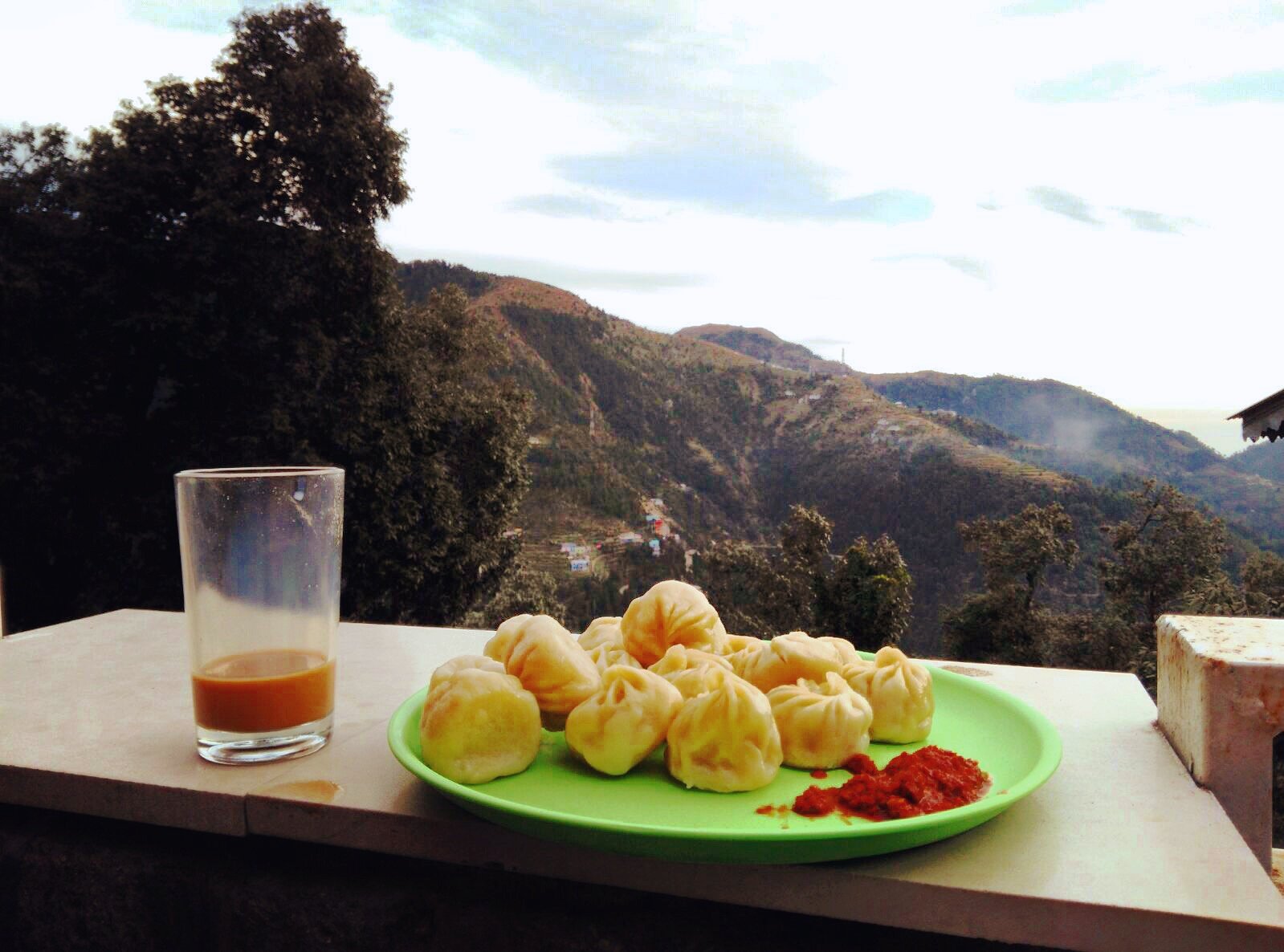 Momos and tea, with a view. â€” Himachal Pradesh